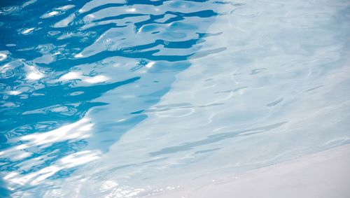 Clean, still pool water catching the light
