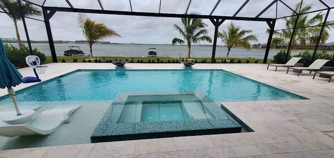 A long infinity edge pool and spa looking out over the water